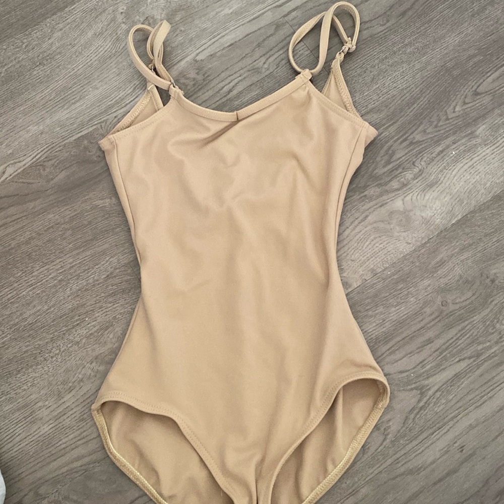 don’t know if this is a bodysuit early leotard, but it’s tan and never been worn